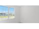 Bright bedroom with a large window offering neighborhood views at 27407 Deep Creek Blvd, Punta Gorda, FL 33983