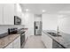 Modern kitchen with granite countertops, stainless steel appliances, and ample cabinet space at 27407 Deep Creek Blvd, Punta Gorda, FL 33983