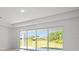 Bright living room filled with natural light from sliding glass doors to the backyard at 27407 Deep Creek Blvd, Punta Gorda, FL 33983