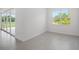 Spacious living room with sliding glass doors offering ample natural light and backyard access at 27407 Deep Creek Blvd, Punta Gorda, FL 33983