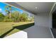 A lovely patio offers scenic views of the backyard's lush greenery and mature trees at 27407 Deep Creek Blvd, Punta Gorda, FL 33983