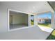 Covered patio with sliding glass doors offers an indoor-outdoor living experience at 27407 Deep Creek Blvd, Punta Gorda, FL 33983