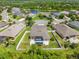 Aerial view of a home with a fenced backyard, blue pergola, and surrounding area at 2819 130Th E Ave, Parrish, FL 34219