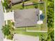 A bird's eye view of the property, featuring a fenced backyard and a covered patio area at 2819 130Th E Ave, Parrish, FL 34219