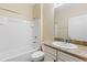 This bathroom features a granite-topped vanity, a tub, and bright lighting at 2819 130Th E Ave, Parrish, FL 34219