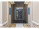 Inviting front entryway featuring decorative stonework and a secure storm door at 2819 130Th E Ave, Parrish, FL 34219