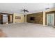 Expansive living room with stone accent wall, neutral carpet, and access to other parts of the home at 2819 130Th E Ave, Parrish, FL 34219