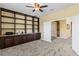 Office with built in shelving and a stone accent wall at 2819 130Th E Ave, Parrish, FL 34219