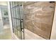 Renovated bathroom with glass shower door and tiled walls at 314 28Th W St, Bradenton, FL 34205