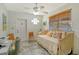 Inviting bedroom with a daybed, tile floor, and natural light at 314 28Th W St, Bradenton, FL 34205