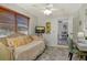 Welcoming bedroom featuring a comfortable daybed, unique decor, and ample light at 314 28Th W St, Bradenton, FL 34205