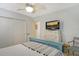 Spacious bedroom with white ceiling fan, large windows, and simple color scheme at 314 28Th W St, Bradenton, FL 34205