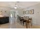 Bright dining room with a ceiling fan, neutral tones, and easy access to the pool area at 314 28Th W St, Bradenton, FL 34205