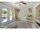 Bright living room with access to the pool, ceiling fan, and comfortable decor at 314 28Th W St, Bradenton, FL 34205