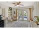 Bright living area with doors leading to the pool, ceiling fan and a cozy decor at 314 28Th W St, Bradenton, FL 34205