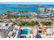 Expansive aerial shot showcases a marina near modern buildings, offering a glimpse of waterfront living at 33 S Palm # 1103, Sarasota, FL 34236