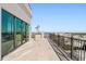 Spacious balcony with sliding glass doors and railing, offering panoramic views of the city at 33 S Palm # 1103, Sarasota, FL 34236