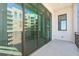 Large balcony showcases building and views, accessed through sliding glass doors at 33 S Palm # 1103, Sarasota, FL 34236