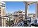 Private balcony with city views, includes comfortable seating and a small coffee table at 33 S Palm # 1103, Sarasota, FL 34236