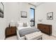 Bright bedroom with neutral decor and large window at 33 S Palm # 1103, Sarasota, FL 34236