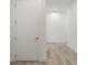 Bright hallway with light wood floors and white walls at 33 S Palm # 1103, Sarasota, FL 34236