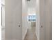 View down a hallway to an open floorplan including the kitchen at 33 S Palm # 1103, Sarasota, FL 34236