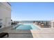 Rooftop pool with views of the bay and lounge chairs for relaxing poolside at 33 S Palm # 1103, Sarasota, FL 34236