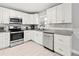 Well-equipped kitchen featuring white cabinets, stainless steel appliances, and modern countertops at 3403 15Th W Ave, Bradenton, FL 34205