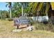 Sienna Park community sign surrounded by tropical landscaping at 3403 Clark Rd # 203, Sarasota, FL 34231