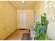Condo entryway featuring tile flooring, white door, and space for seating at 3403 Clark Rd # 203, Sarasota, FL 34231