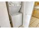 Stacked washer and dryer in a closet laundry area at 3403 Clark Rd # 203, Sarasota, FL 34231