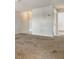 Inviting living room with carpeted flooring, neutral walls, and plenty of natural light at 3403 Clark Rd # 203, Sarasota, FL 34231