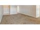 Bright, carpeted living room offering an open layout and easy access to other rooms at 3403 Clark Rd # 203, Sarasota, FL 34231