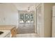 Bright living area with access to kitchen and nice large windows showcasing the beautiful outdoors at 3403 Clark Rd # 203, Sarasota, FL 34231