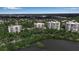 Stunning aerial view of waterfront condominiums surrounded by lush landscaping at 3621 North Point Rd # 603, Osprey, FL 34229