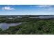 Aerial view of property with abundant greenery and waterfront views at 3621 North Point Rd # 603, Osprey, FL 34229
