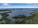 Expansive aerial view with waterways and cityscape beyond at 3621 North Point Rd # 603, Osprey, FL 34229
