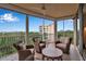 Lovely balcony offering comfortable seating and beautiful views of the waterway and distant buildings at 3621 North Point Rd # 603, Osprey, FL 34229
