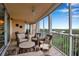 Spacious balcony with comfortable seating, providing breathtaking views of the water and surrounding landscape at 3621 North Point Rd # 603, Osprey, FL 34229