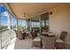 Screened balcony with tile flooring, seating and beautiful views at 3621 North Point Rd # 603, Osprey, FL 34229