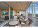 Inviting balcony furnished with cozy chairs, showcasing stunning views of the water and lush surroundings at 3621 North Point Rd # 603, Osprey, FL 34229