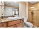 Stylish bathroom featuring a granite countertop, vessel sink, and a walk-in shower with decorative tile accents at 3621 North Point Rd # 603, Osprey, FL 34229