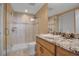 Renovated bathroom with granite counters, modern tile, and a glass shower at 3621 North Point Rd # 603, Osprey, FL 34229