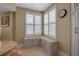 Charming breakfast nook featuring custom seating and bright windows with plantation shutters at 3621 North Point Rd # 603, Osprey, FL 34229