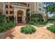 Beautiful building entrance with brick walkway and lush landscaping at 3621 North Point Rd # 603, Osprey, FL 34229