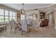 Well-lit dining area with pendant lighting, seating for six, and an open flow to the kitchen at 3621 North Point Rd # 603, Osprey, FL 34229