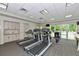 Bright fitness center featuring modern treadmills, machines, and a mirrored wall at 3621 North Point Rd # 603, Osprey, FL 34229