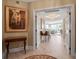 Foyer with detailed chandelier and decor leading into the living room at 3621 North Point Rd # 603, Osprey, FL 34229