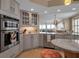 Bright kitchen with stainless steel appliances and an open floor plan at 3621 North Point Rd # 603, Osprey, FL 34229