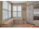 Bright breakfast nook with custom seating, natural light, and storage at 3621 North Point Rd # 603, Osprey, FL 34229